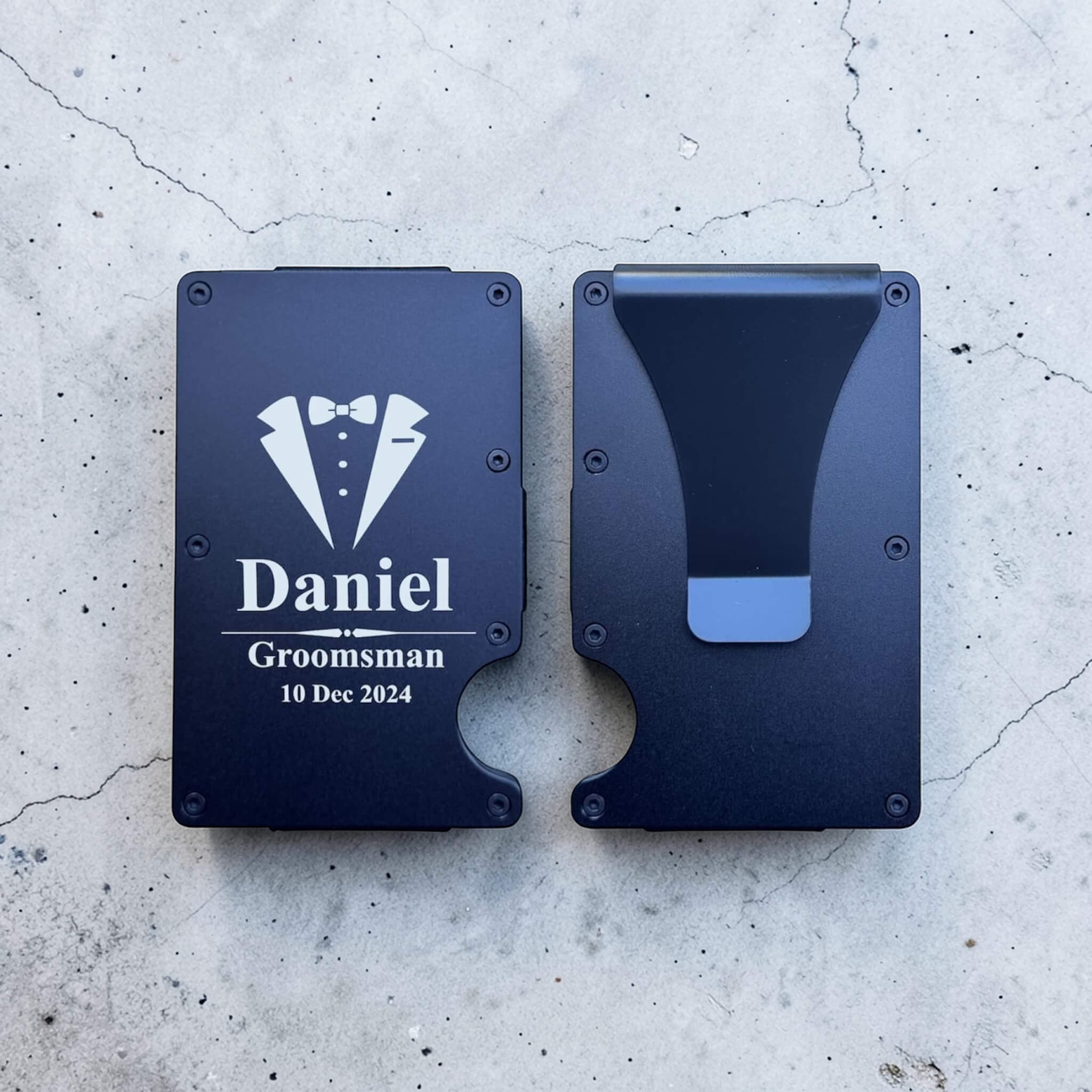 Front and back view of an engraved card holder showing the personalised face and secure cash clip