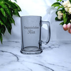 Graduation beer glass being used to toast academic achievement