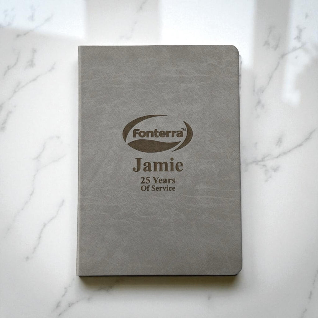 Grey personalised A4 hardcover journal with engraved company logo and employee name, ideal for corporate gifts and service awards in New Zealand.