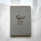 Grey personalised A4 hardcover journal with engraved company logo and employee name, ideal for corporate gifts and service awards in New Zealand.