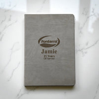 Grey personalised A4 hardcover journal with engraved company logo and employee name, ideal for corporate gifts and service awards in New Zealand.