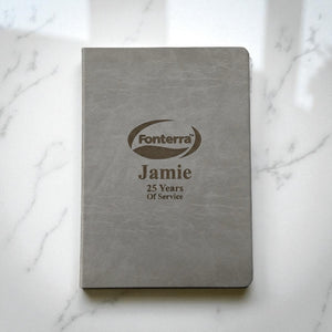 Grey personalised A4 hardcover journal with engraved company logo and employee name, ideal for corporate gifts and service awards in New Zealand.