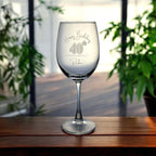 Laser-engraved birthday wine glass photographed in a relaxed indoor lifestyle setting.
