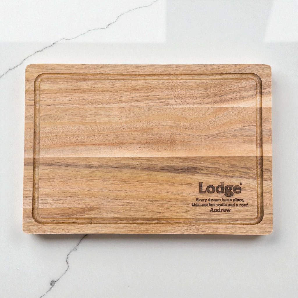 Laser engraved acacia serving board showing Lodge logo and personalised text, high-quality wooden gift for business promotions and staff appreciation.