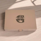 Lifestyle shot of engraved jewellery holder with initials, photographed with flowers and jewellery.
