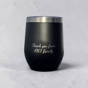 Matte black cup engraved with a script message reading Thank you from ANZ family, an example of a client thank you gift