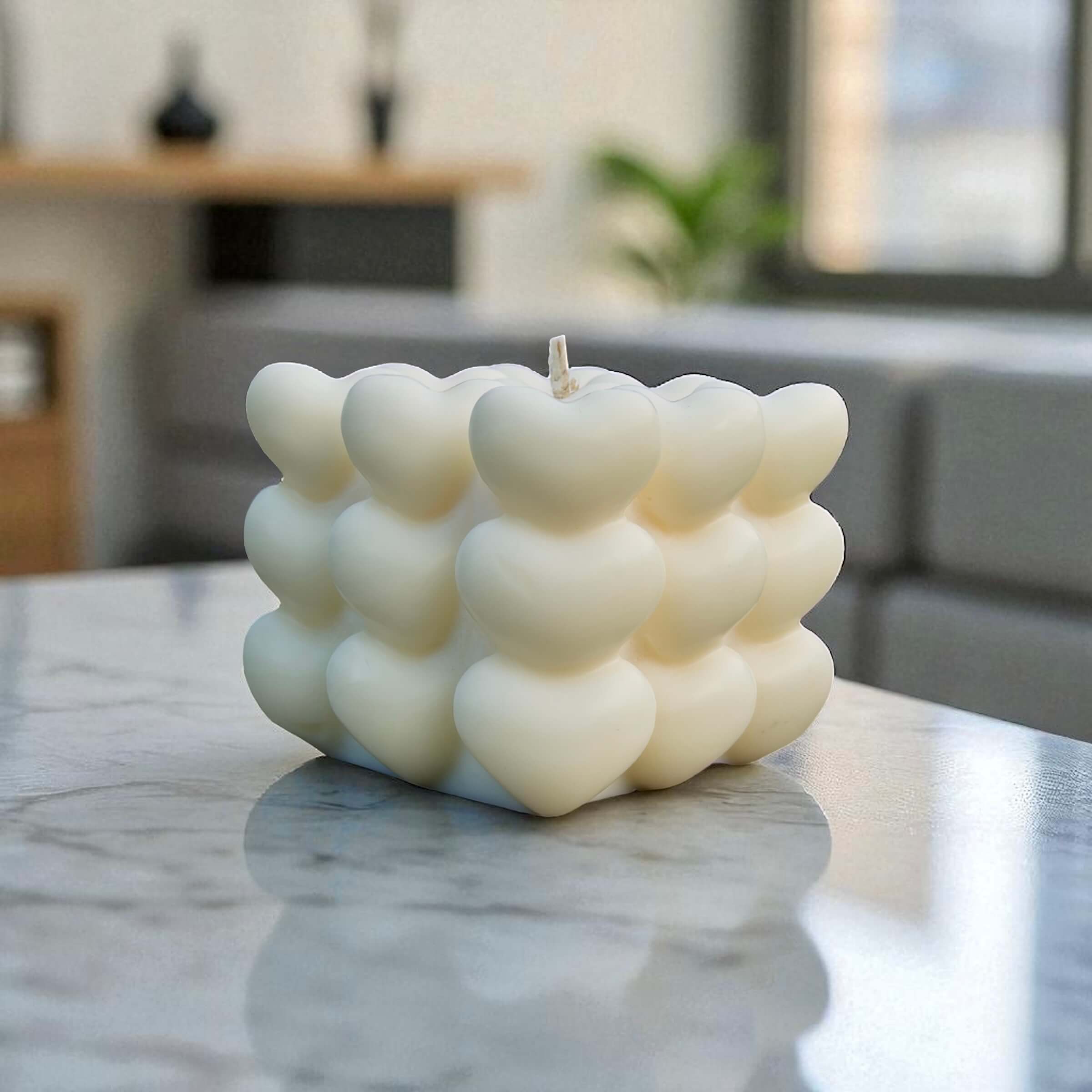 Modern white candle with stacked heart cube design, perfect for gifting or luxury home styling