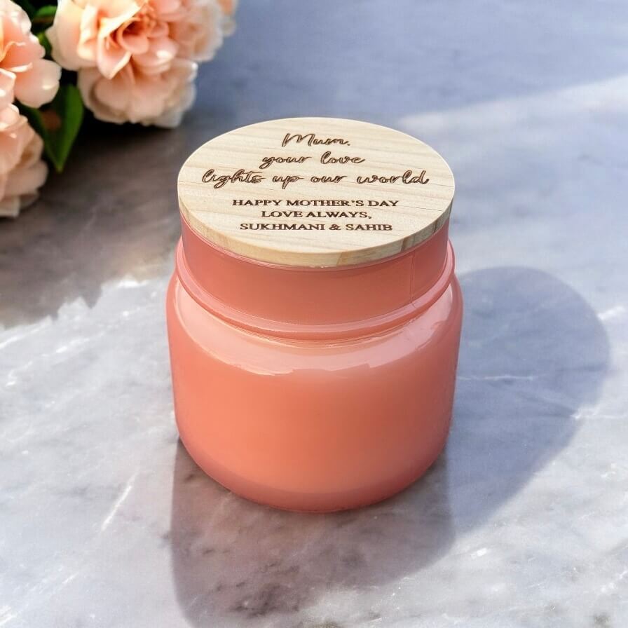 Open-top view of candle with custom engraved message lid