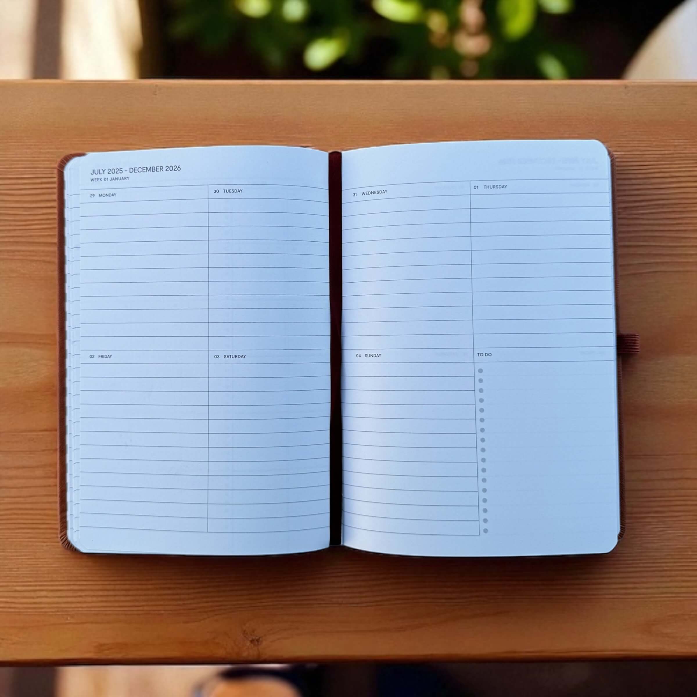 Open A5 weekly planner showing July 2025 to December 2026 week to view pages