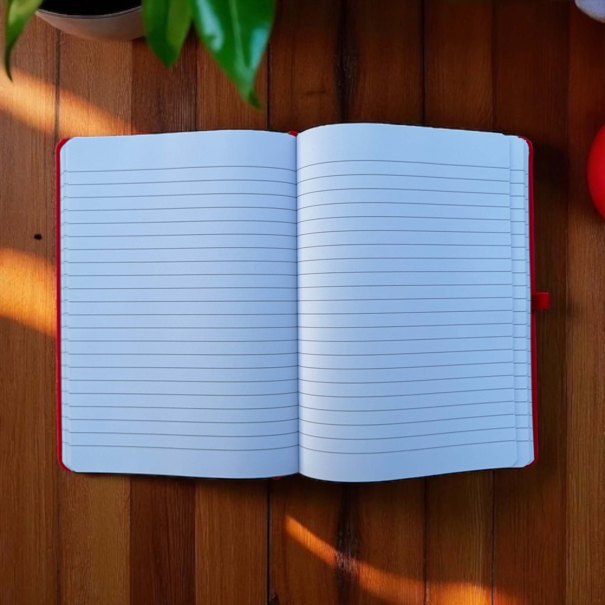 Open notebook on a wooden surface with natural light