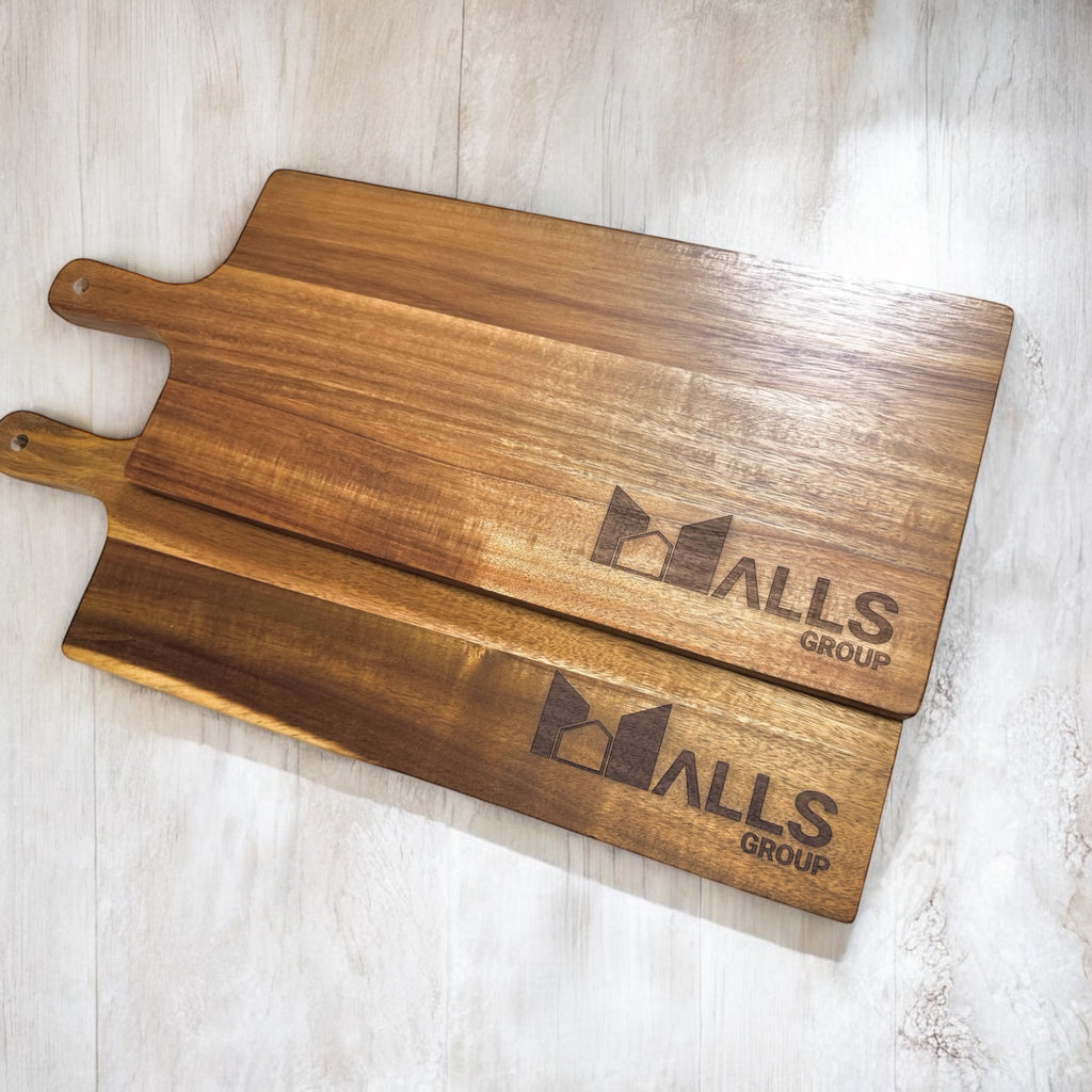 Pair of business-branded serving boards showcasing smooth grain and custom etching