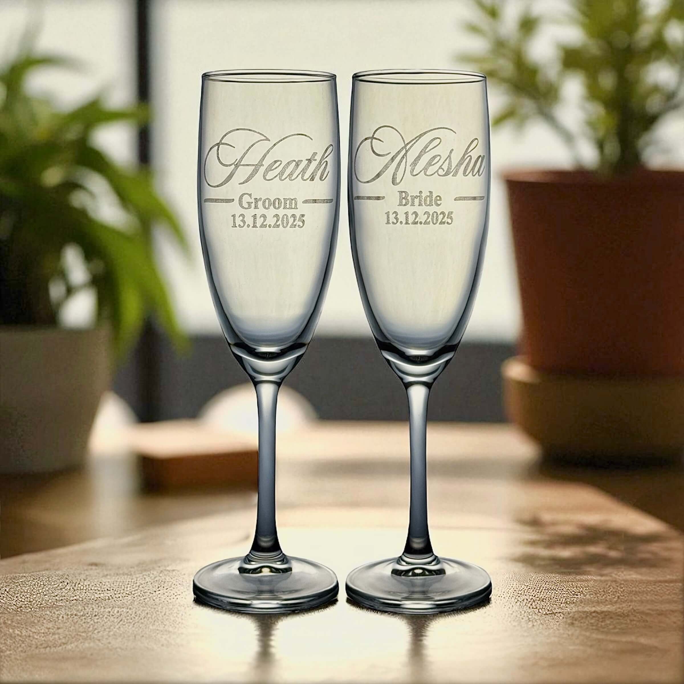 Pair of engraved Mr & Mrs wedding champagne flutes with names and date.