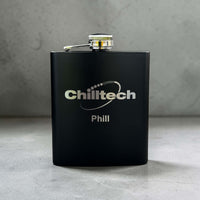Personalised Black flask with 'Chilltech' branding on a gray surface