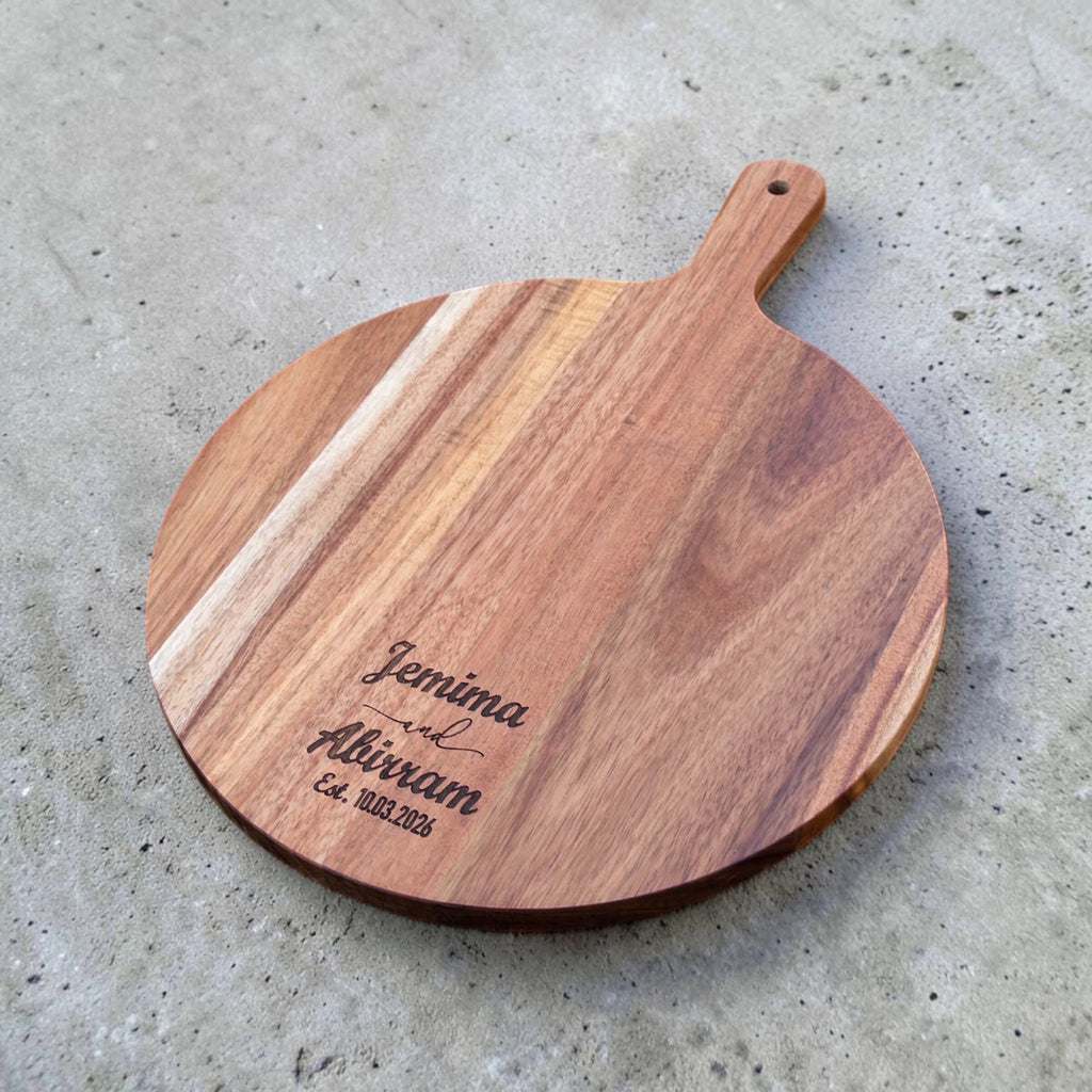 Personalised acacia board with names and date engraved near the lower edge