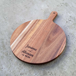 Personalised acacia board with names and date engraved near the lower edge
