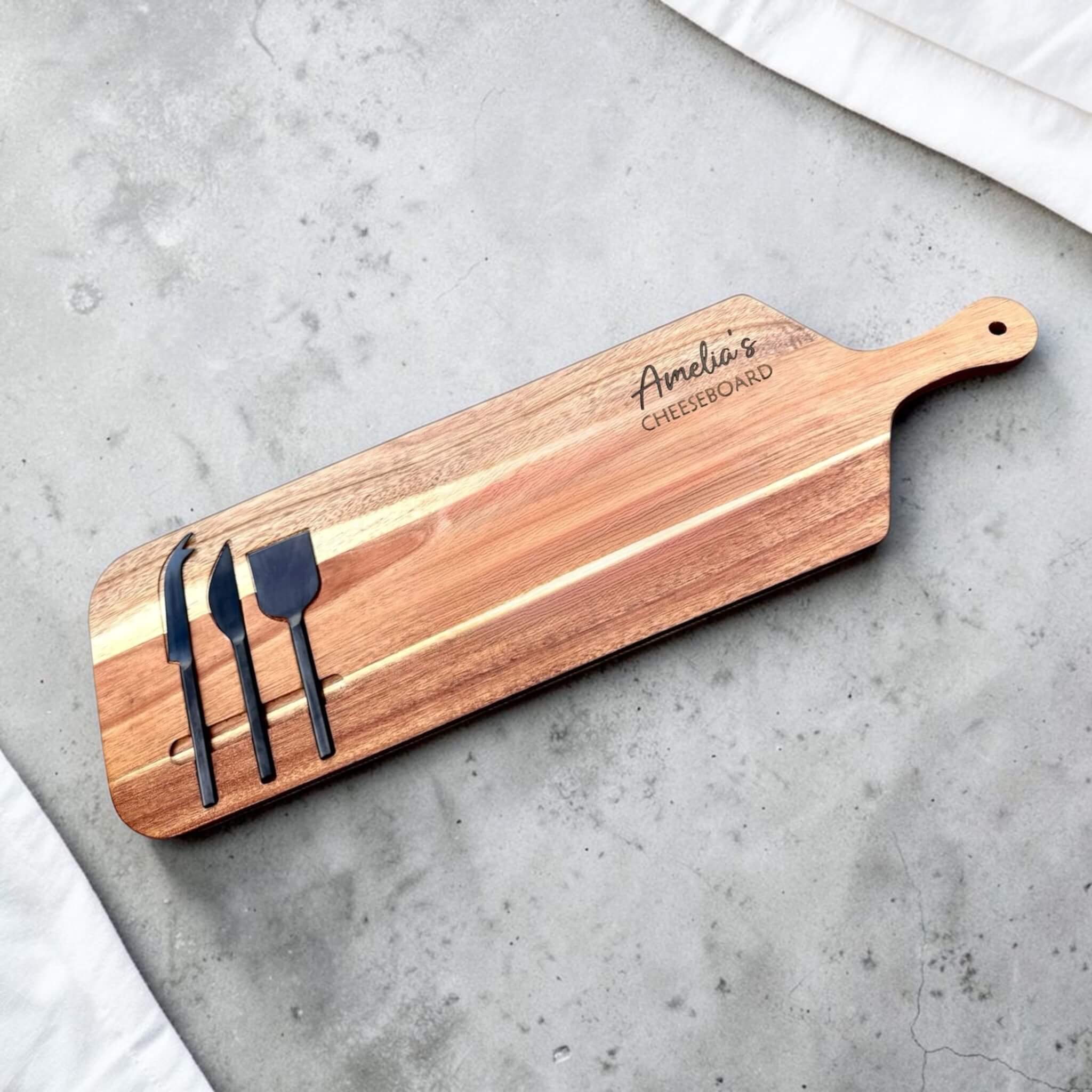 Personalised acacia wood cheeseboard engraved with custom name, long handled cheeseboard with three black cheese knives, personalised birthday gift NZ