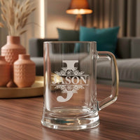 Personalised beer mug engraved with the letter J and name Jason, displayed on wooden table in modern living room setting