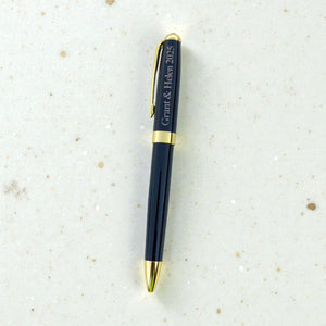 Personalised black ballpoint pen engraved with Grant and Helen 2025 and finished with gold trim