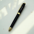 Personalised engraved pen lying diagonally on white background