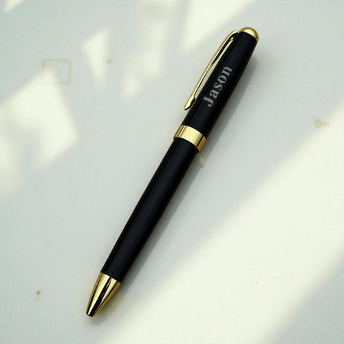 Personalised engraved pen lying diagonally on white background