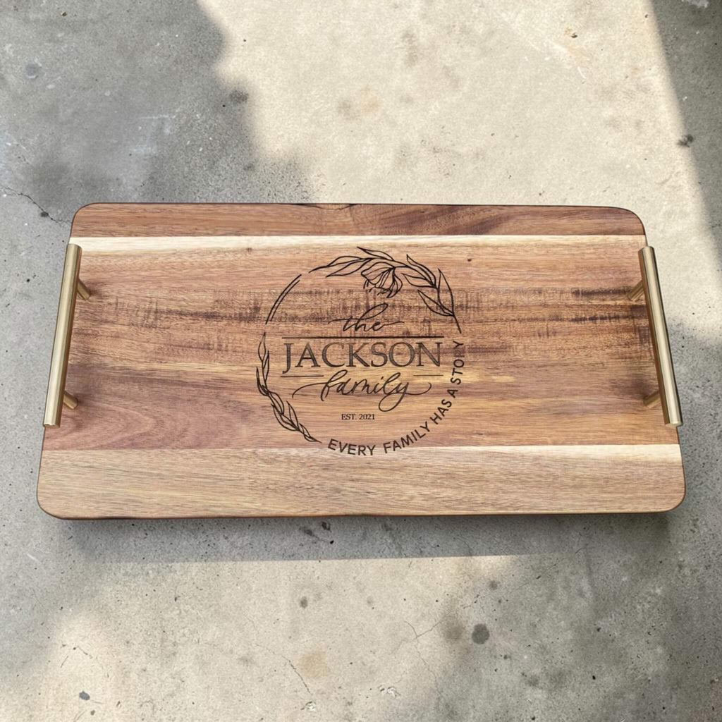 Personalised family name serving platter with gold handles, laser engraved wooden tray with floral wreath design and custom surname, unique housewarming gift NZ