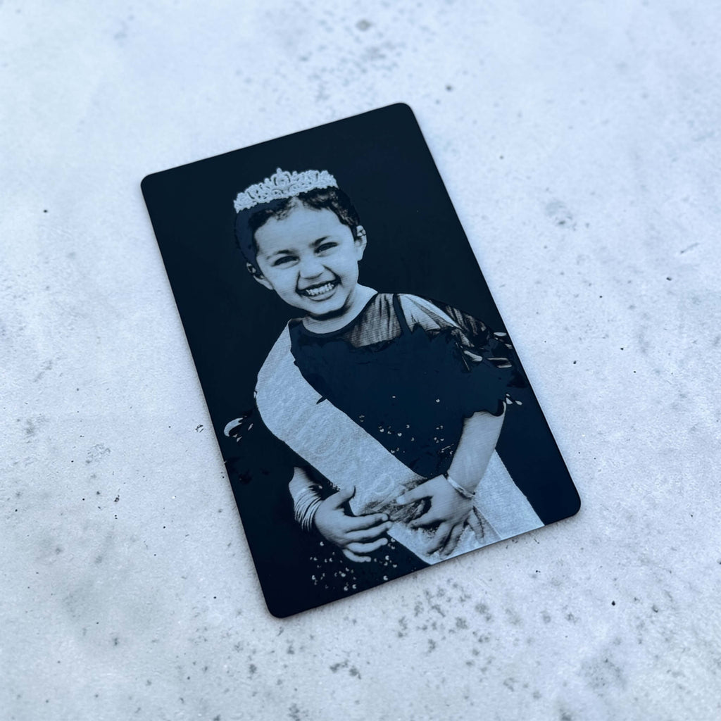 Personalised photo gift card with black aluminium finish on pale textured background