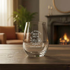 Personalised stemless wine glass engraved with “The World’s Best Mum” and floral design on wooden table