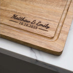 Personalised wedding chopping board engraved with couple names and date, acacia wood gift for newlyweds, anniversaries, or engagements.