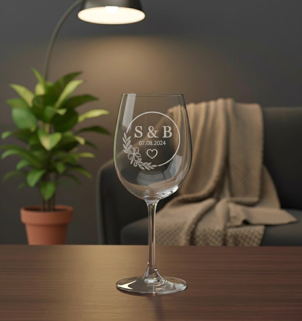 Personalised wine glass for weddings showing engraved initials and date with heart detail