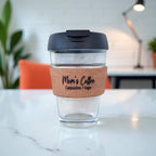 Reusable cork and glass cup engraved “Mom’s Coffee Cappuccino 1 Sugar” with black lid