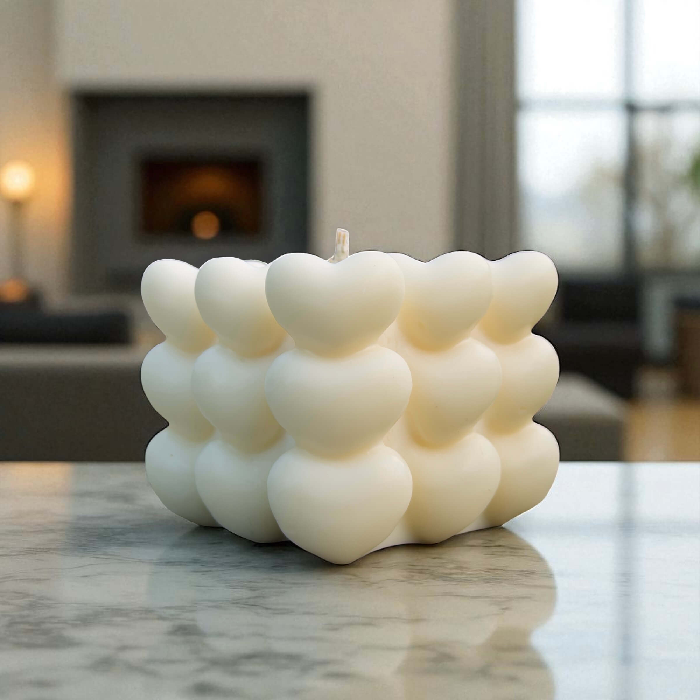 Sculptural white heart candle with layered heart texture, handcrafted romantic gift or modern centrepiece