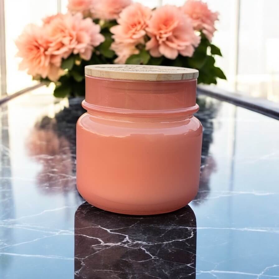 Side angle of personalised candle showing elegant glass shape and smooth wax finish with warm light