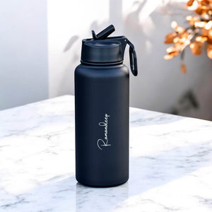 Side view of bottle showing straw and sleek cylindrical shape