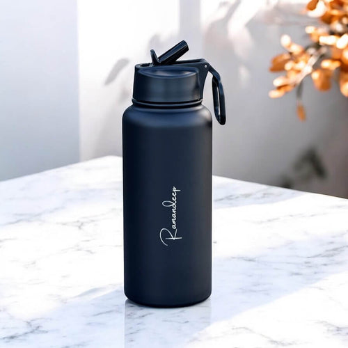 Side view of bottle showing straw and sleek cylindrical shape