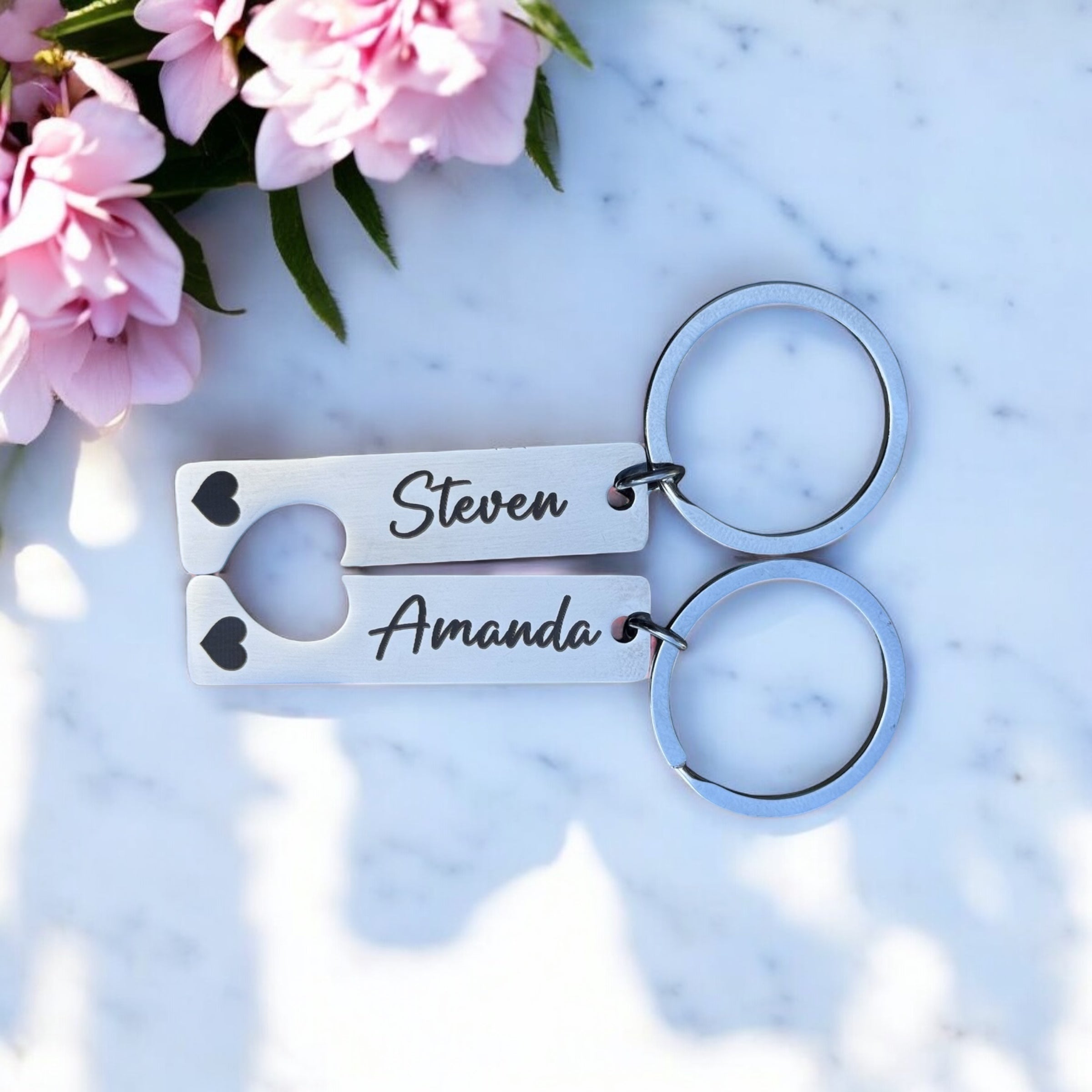 Silver rectangular keyrings with matching heart cut-outs for couples