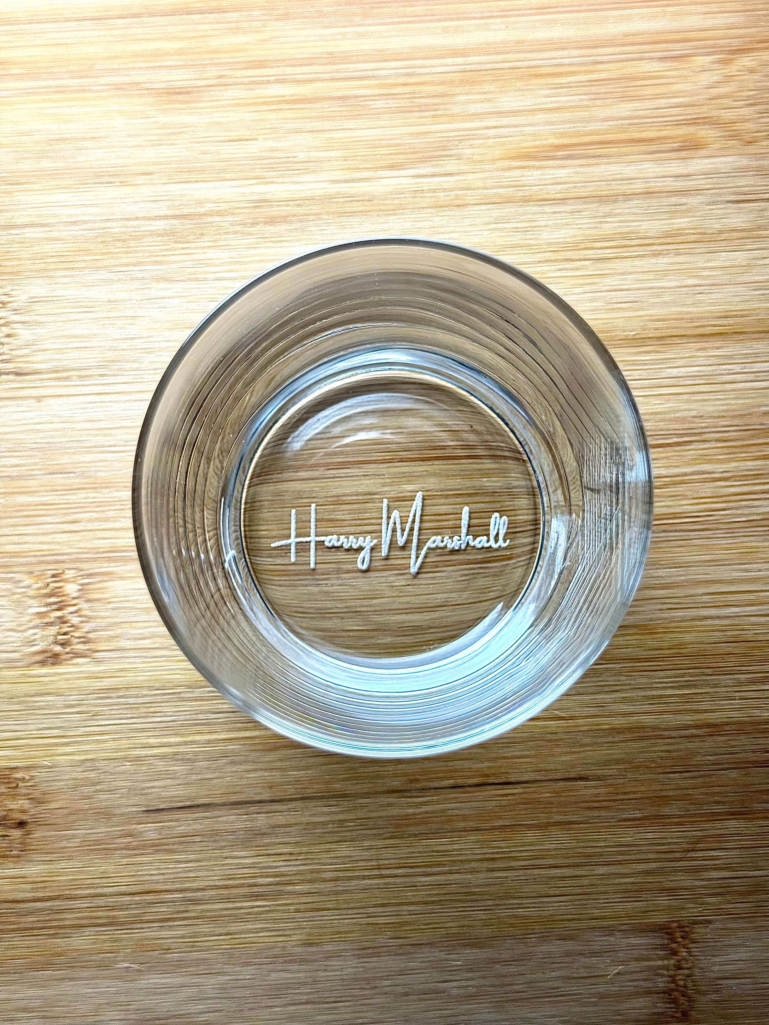 Top-down view of the glass highlighting precise laser-engraving on the base