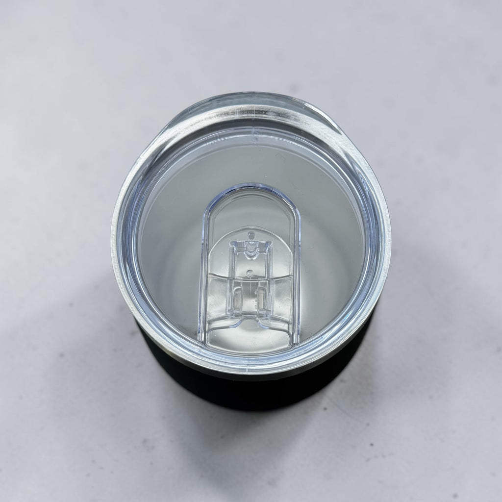 Top view of 300ml corporate coffee with a clear lid on a light grey background