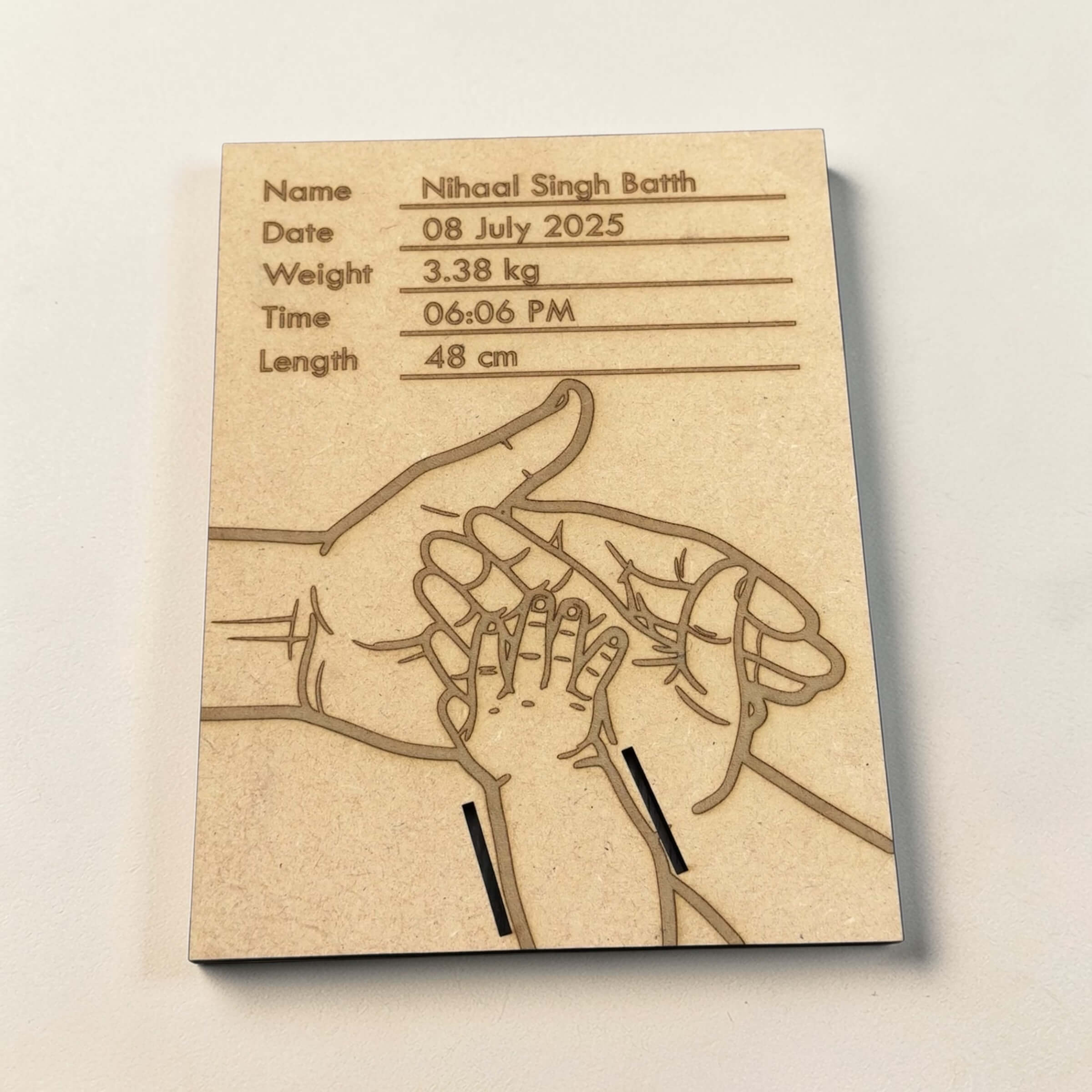 Wooden birth stats plaque showing baby name, date, weight, time and length