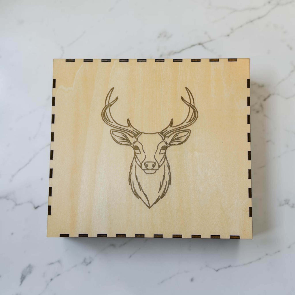 Wooden hip flask gift box with engraved stag head design on the lid