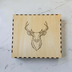 Wooden hip flask gift box with engraved stag head design on the lid