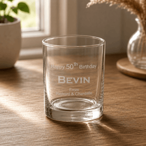 Close up engraved birthday whiskey tumbler with custom name and 50th birthday text