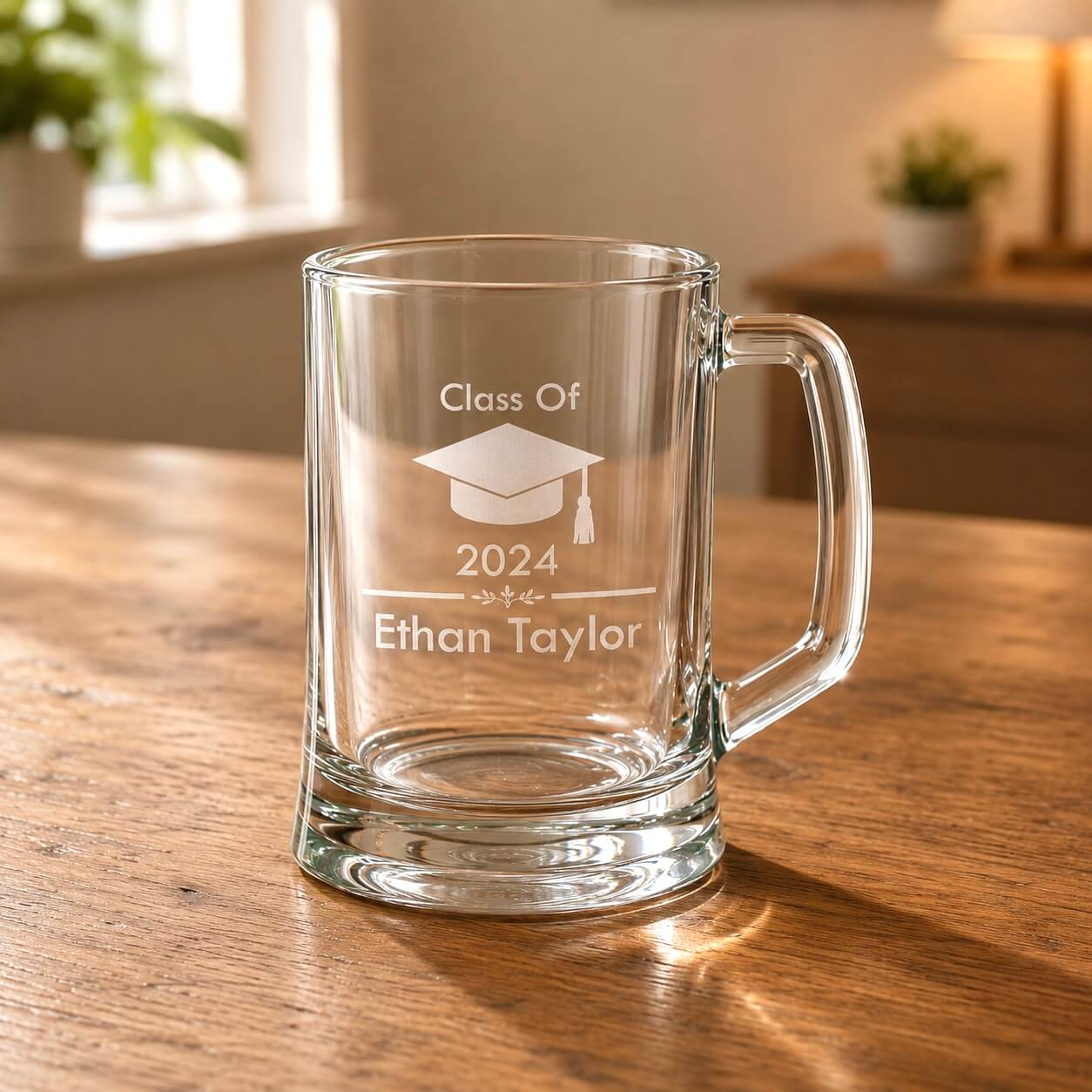Close up personalised graduation beer mug with cap design and Ethan Taylor name
