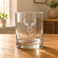Engraved 21st birthday stag whiskey glass with Happy 21st Luke personalisation on wooden table