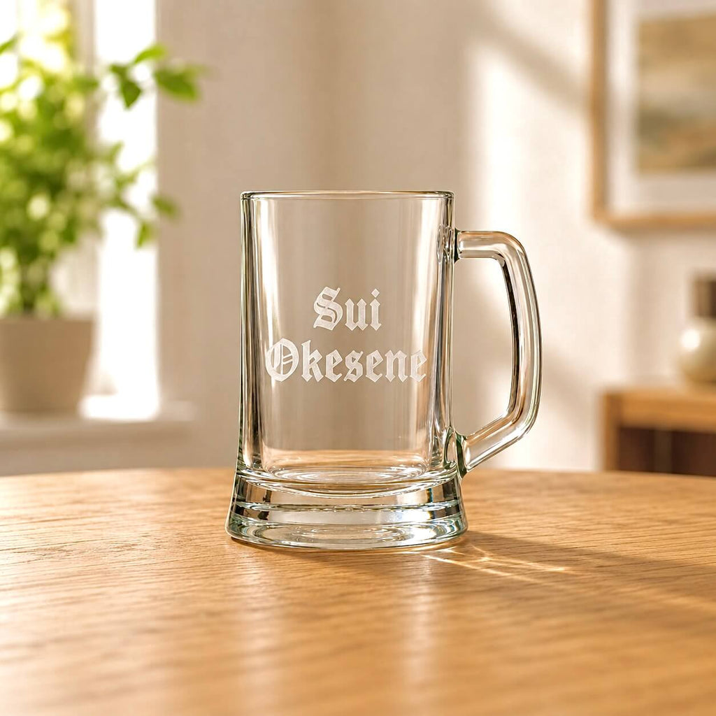 Engraved beer glass with Sui Okesene Old English font, thick base and clear handle