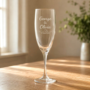 Engraved bridal party champagne flute with George and Olivia names and wedding date