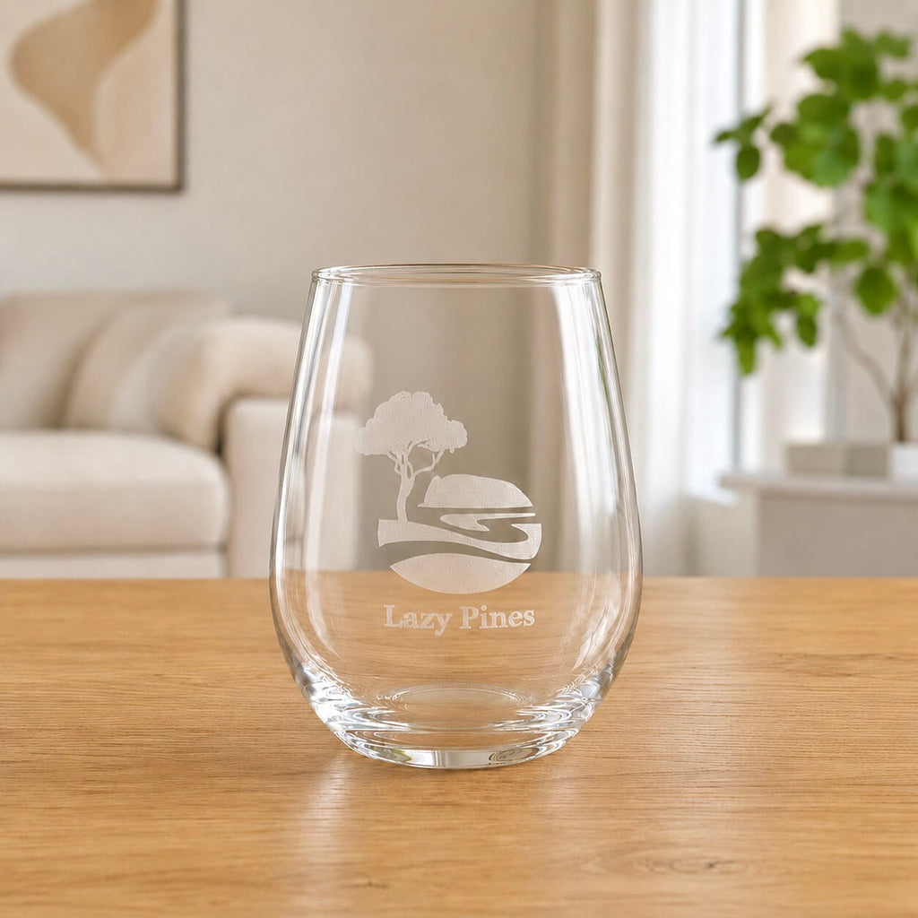 Engraved stemless wine glass with frosted Lazy Pines logo and rounded clear glass shape