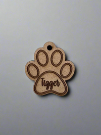 engraved wooden cat id tag in cat paw shape with name