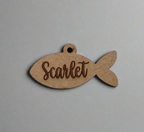 engraved wooden cat id tag in fish shape