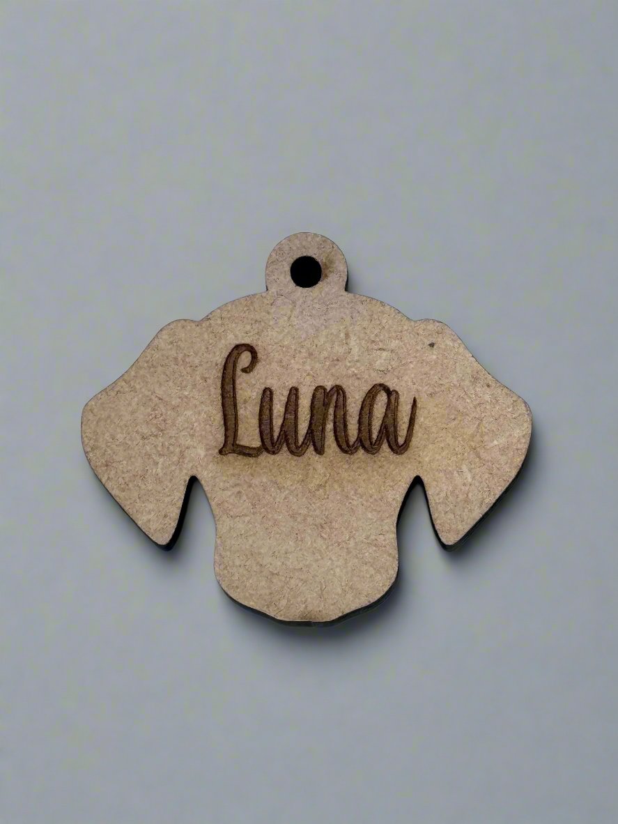 engraved wooden dog id tag in dog face shape with name