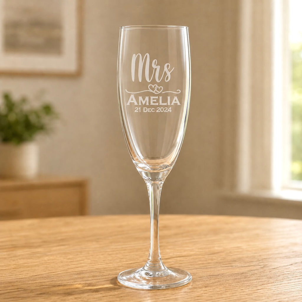 Clear glass Mrs champagne flute with frosted Amelia name and 21 Dec 2024 wedding date